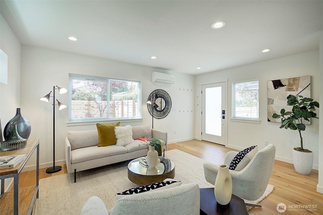 2904 W Bertona St, Seattle, WA 98199 - living room featuring a wall mounted AC, wood finished floors, and recessed lighting