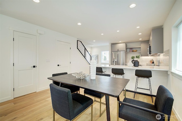 2904 W Bertona St, Seattle, WA 98199 - dining space with recessed lighting, plenty of natural light, stairs, and light wood-style flooring