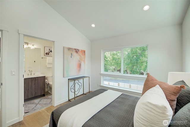 2904 W Bertona St, Seattle, WA 98199 - bedroom with light wood-style floors, vaulted ceiling, recessed lighting, and connected bathroom