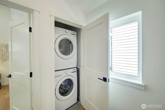 2904 W Bertona St, Seattle, WA 98199 - washroom with estacked washer and dryer and light wood-style flooring