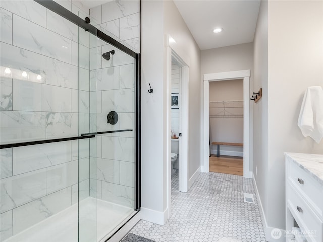 168 Lakeside Dr, Mossyrock, WA 98564 - full bathroom featuring a stall shower, a walk in closet, and vanity