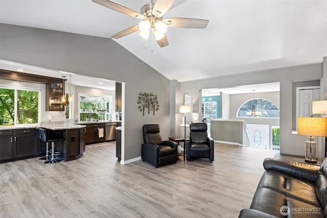 13233 59th Ave W, Edmonds, WA 98026 - living room featuring light wood finished floors, a ceiling fan, a chandelier, and high vaulted ceiling