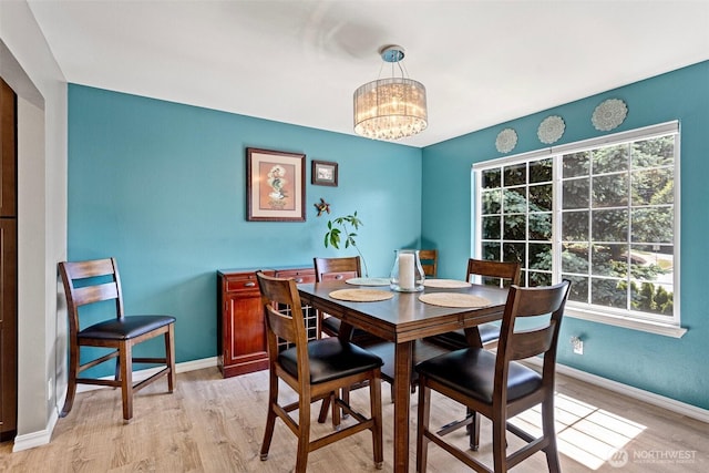 13233 59th Ave W, Edmonds, WA 98026 - dining space featuring a chandelier, healthy amount of natural light, and light wood-style flooring