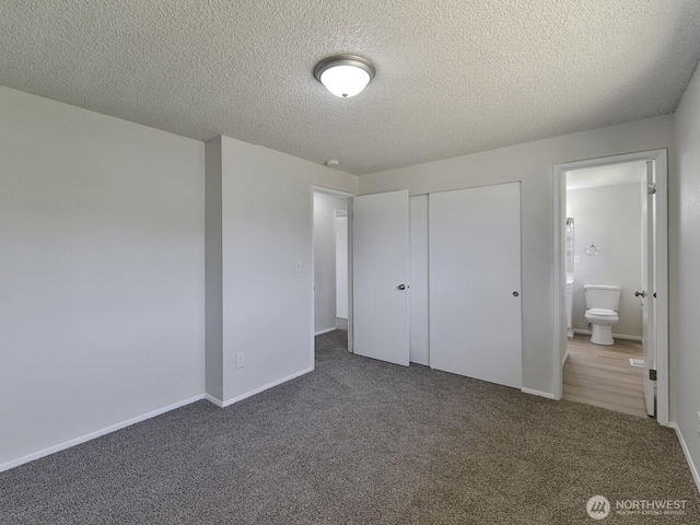 1501 154th St E, Tacoma, WA 98445 - unfurnished bedroom with carpet, a closet, a textured ceiling, and ensuite bath