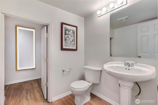 8415 15th Ave SE, Olympia, WA 98513 - bathroom with wood finished floors and toilet