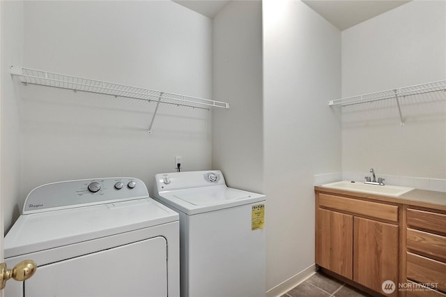 8415 15th Ave SE, Olympia, WA 98513 - washroom featuring separate washer and dryer, cabinet space, and tile patterned floors