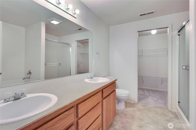 8415 15th Ave SE, Olympia, WA 98513 - full bathroom featuring a shower stall, a spacious closet, and double vanity