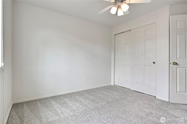 8415 15th Ave SE, Olympia, WA 98513 - unfurnished bedroom featuring carpet floors, a closet, and ceiling fan