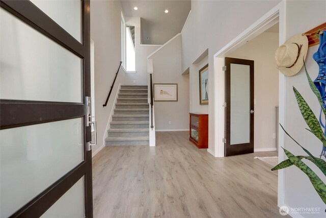 4615 SW Olivine Dr SW, Port Orchard, WA 98367 - foyer entrance featuring stairway, light wood-type flooring, recessed lighting, and a high ceiling