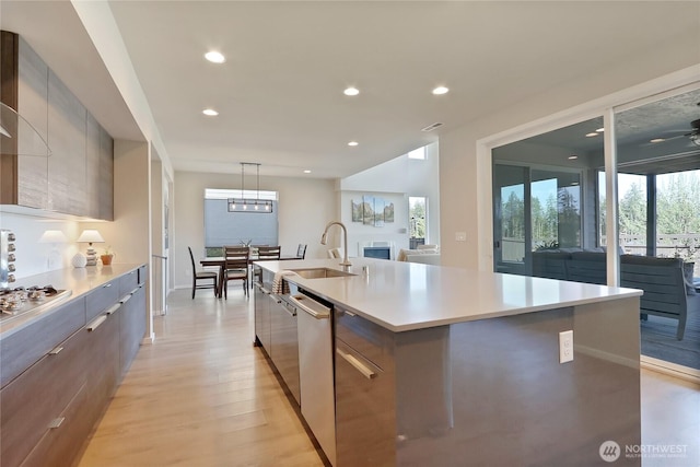 4615 SW Olivine Dr SW, Port Orchard, WA 98367 - kitchen with modern cabinets, a large island, recessed lighting, light countertops, and stainless steel appliances