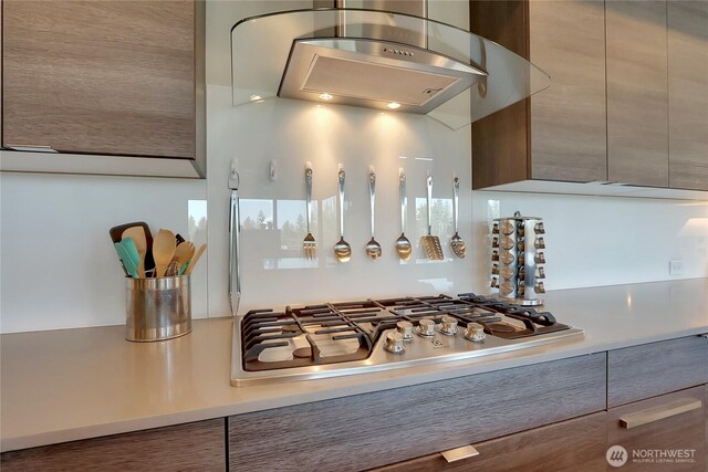 4615 SW Olivine Dr SW, Port Orchard, WA 98367 - kitchen view of stainless steel gas stovetop, modern cabinets, ventilation hood, and light countertops