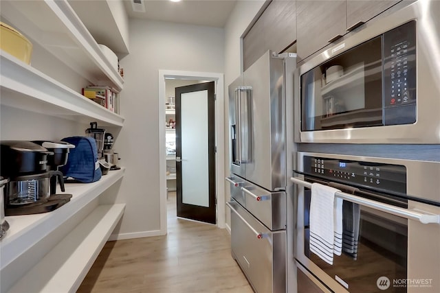 4615 SW Olivine Dr SW, Port Orchard, WA 98367 - kitchen with appliances with stainless steel finishes, modern cabinets, light wood-style floors, and light countertops