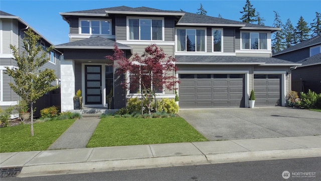 4615 SW Olivine Dr SW, Port Orchard, WA 98367 - prairie-style house with an attached garage, concrete driveway, a front yard, and a shingled roof