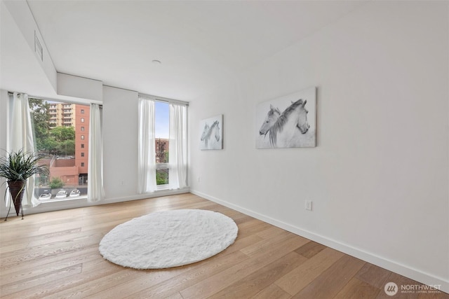 450 S Main St Unit 505, Seattle, WA 98101 - unfurnished room with wood finished floors and healthy amount of natural light
