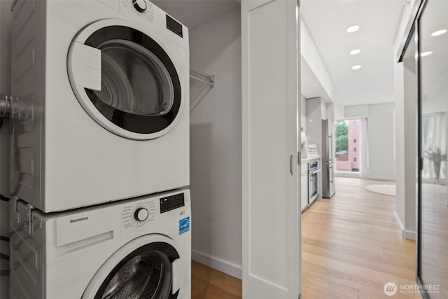 450 S Main St Unit 505, Seattle, WA 98101 - laundry room with estacked washer and dryer, light wood-style floors, and recessed lighting