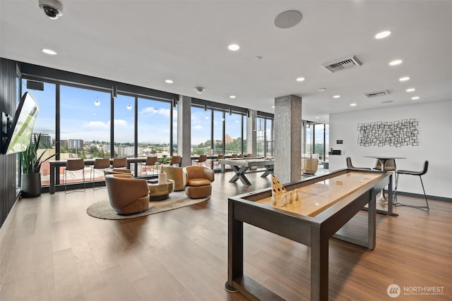 450 S Main St Unit 505, Seattle, WA 98101 - game room featuring wood finished floors, a wall of windows, and recessed lighting