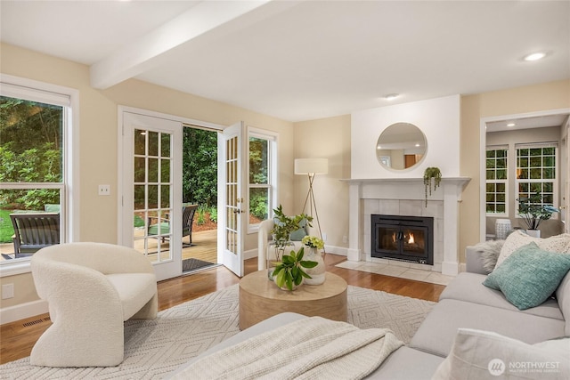 7089 NE Bay Hill Rd, Bainbridge Island, WA 98110 - living area featuring plenty of natural light, wood finished floors, recessed lighting, and beam ceiling
