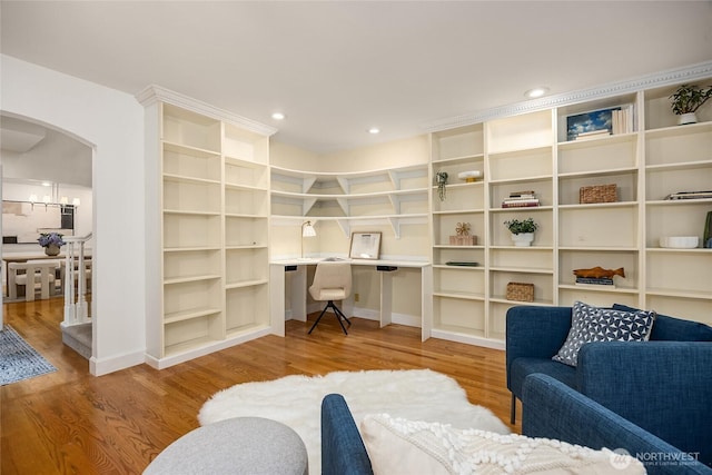 7089 NE Bay Hill Rd, Bainbridge Island, WA 98110 - office area featuring arched walkways, wood finished floors, built in study area, and recessed lighting