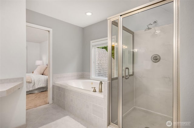 7089 NE Bay Hill Rd, Bainbridge Island, WA 98110 - ensuite bathroom featuring tile patterned floors, a bath, and a shower stall
