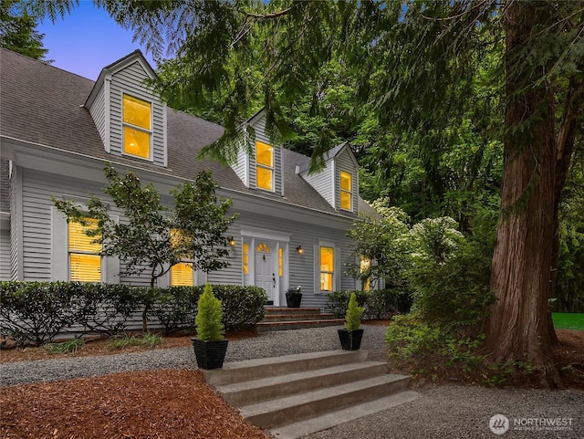 7089 NE Bay Hill Rd, Bainbridge Island, WA 98110 - cape cod home featuring roof with shingles