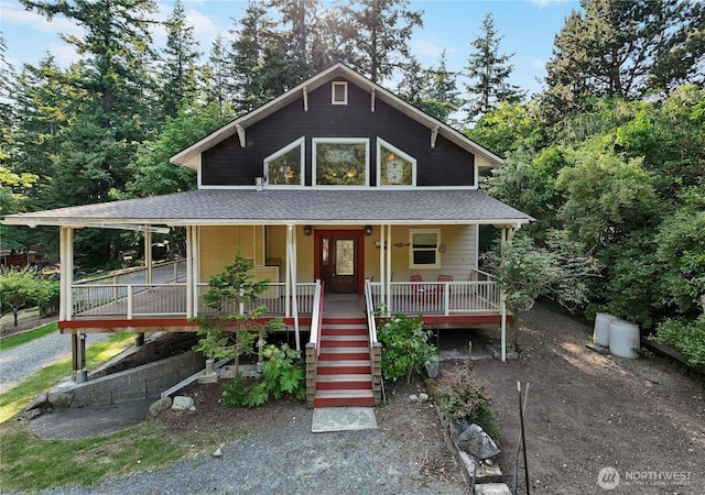 7554 Guemes Island Rd, Anacortes, WA 98221 - view of front of house featuring covered porch, a shingled roof, and stairs
