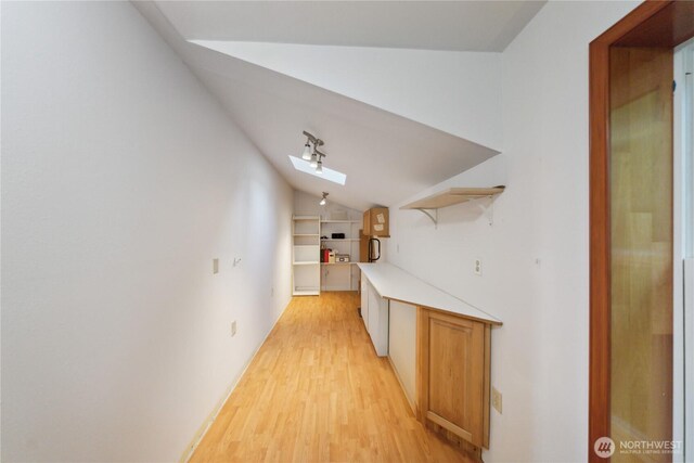 7554 Guemes Island Rd, Anacortes, WA 98221 - corridor featuring vaulted ceiling, light wood-style floors, and a skylight