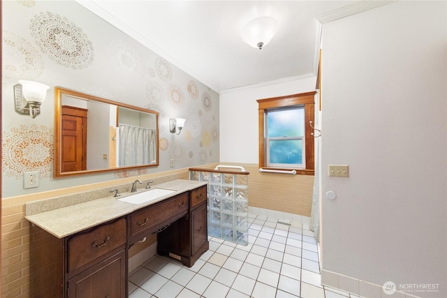 7554 Guemes Island Rd, Anacortes, WA 98221 - full bathroom with wainscoting, vanity, crown molding, wallpapered walls, and tile patterned flooring