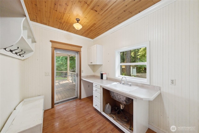 7554 Guemes Island Rd, Anacortes, WA 98221 - kitchen featuring ornamental molding, white cabinetry, open shelves, light countertops, and light wood-style flooring