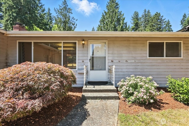 15023 Densmore Ave N, Shoreline, WA 98133 - doorway to property featuring a chimney