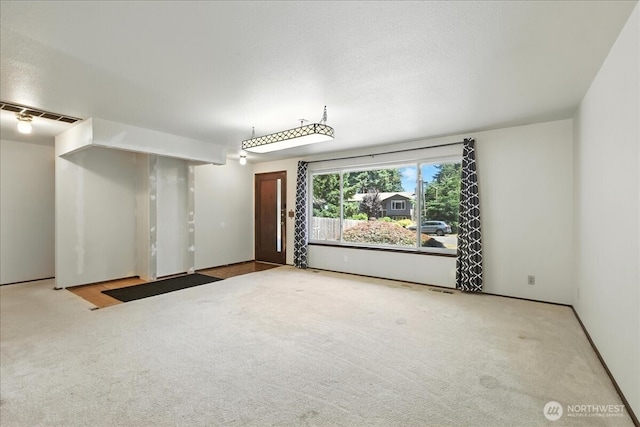 15023 Densmore Ave N, Shoreline, WA 98133 - unfurnished living room featuring carpet