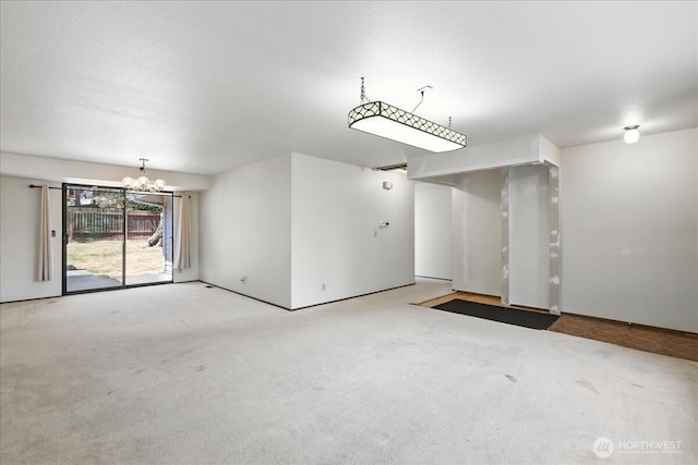 15023 Densmore Ave N, Shoreline, WA 98133 - empty room with a chandelier and carpet flooring