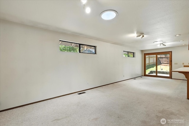 15023 Densmore Ave N, Shoreline, WA 98133 - empty room with light carpet and healthy amount of natural light