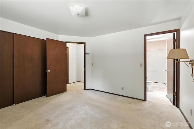 15023 Densmore Ave N, Shoreline, WA 98133 - unfurnished bedroom featuring light colored carpet and connected bathroom