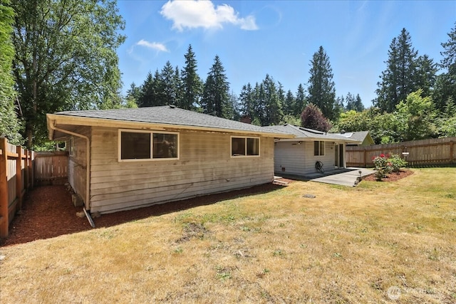 15023 Densmore Ave N, Shoreline, WA 98133 - rear view of house with a fenced backyard and a patio area