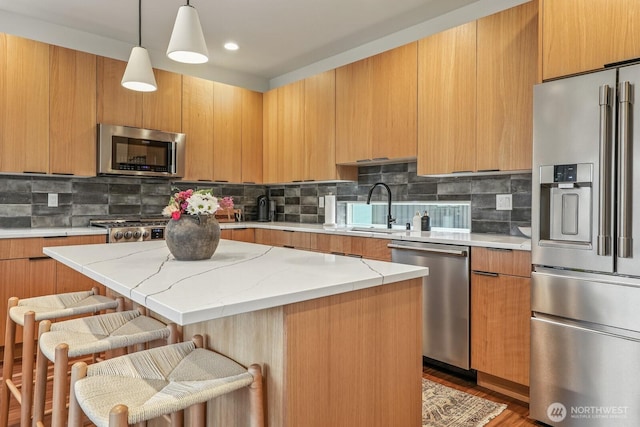4119 Wallingford Ave N Unit C, Seattle, WA 98103 - kitchen featuring stainless steel appliances, modern cabinets, a kitchen bar, a kitchen island, and recessed lighting