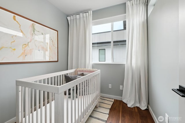 4119 Wallingford Ave N Unit C, Seattle, WA 98103 - bedroom with a crib and wood finished floors