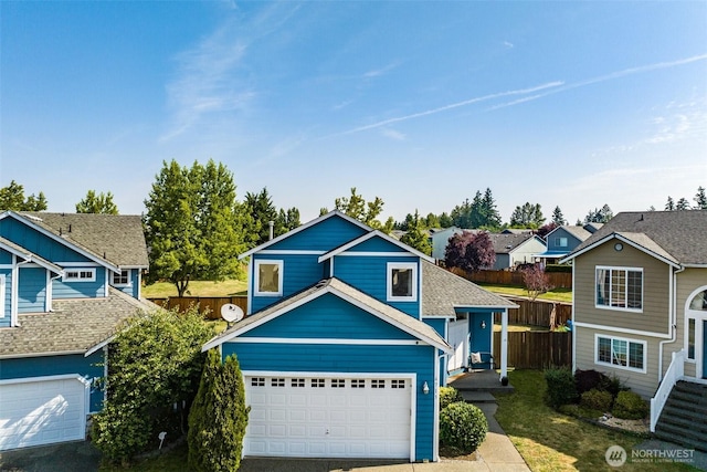 6713 135th E, Puyallup, WA 98373 - view of front of house with driveway, a garage, and a residential view