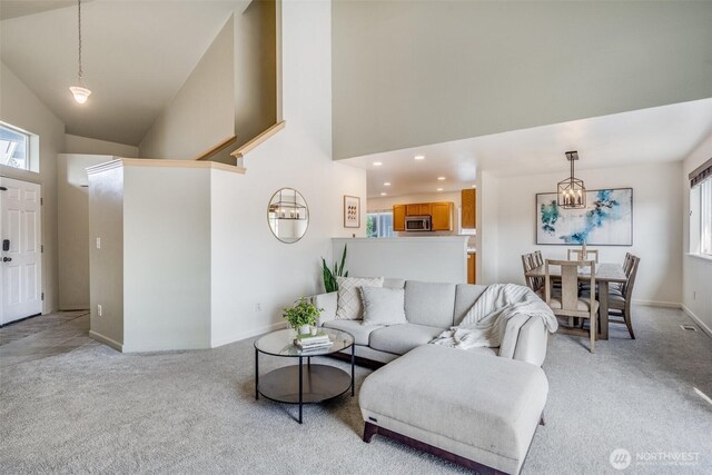 6713 135th E, Puyallup, WA 98373 - living area with light colored carpet, recessed lighting, and high vaulted ceiling