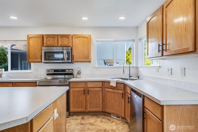 6713 135th E, Puyallup, WA 98373 - kitchen with appliances with stainless steel finishes, light countertops, and recessed lighting