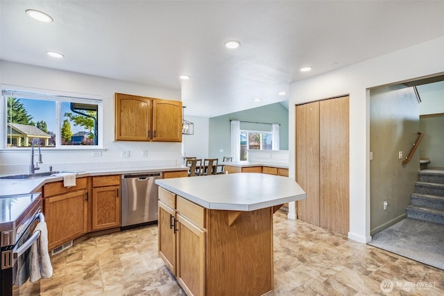 6713 135th E, Puyallup, WA 98373 - kitchen featuring stainless steel dishwasher, stove, recessed lighting, light countertops, and a kitchen island
