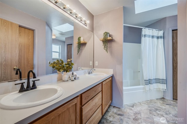 6713 135th E, Puyallup, WA 98373 - bathroom featuring a skylight, double vanity, and shower / tub combo with curtain