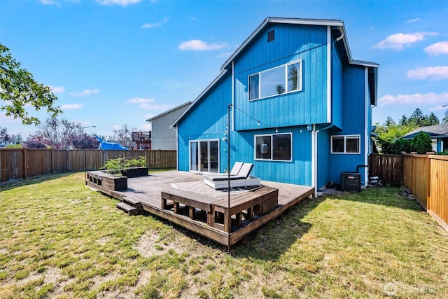 6713 135th E, Puyallup, WA 98373 - back of house with a fenced backyard and a wooden deck