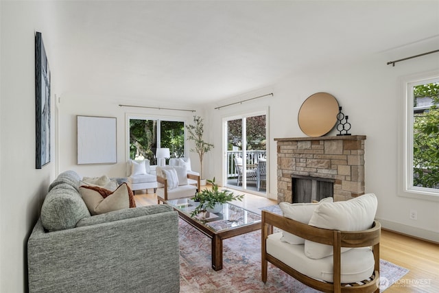 1222 6th Ave N, Seattle, WA 98109 - living area featuring a fireplace and light wood-style flooring