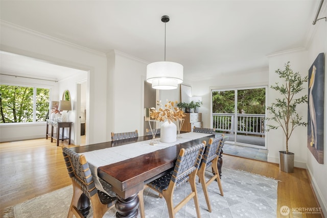 1222 6th Ave N, Seattle, WA 98109 - dining space featuring healthy amount of natural light, light wood-type flooring, and ornamental molding