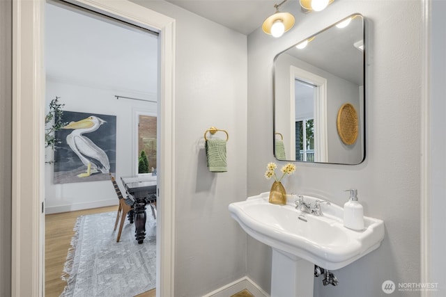 1222 6th Ave N, Seattle, WA 98109 - bathroom featuring wood finished floors and plenty of natural light