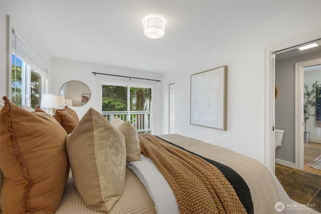 1222 6th Ave N, Seattle, WA 98109 - bedroom featuring multiple windows and ensuite bath