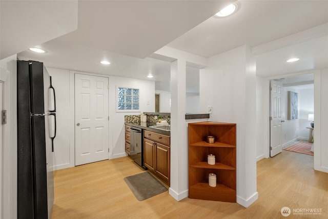 1222 6th Ave N, Seattle, WA 98109 - kitchen with freestanding refrigerator, light wood finished floors, dishwasher, recessed lighting, and brown cabinets