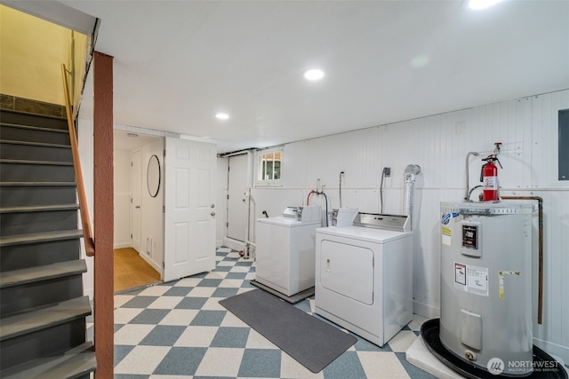 1222 6th Ave N, Seattle, WA 98109 - washroom featuring electric water heater, tile patterned floors, washer and clothes dryer, and recessed lighting