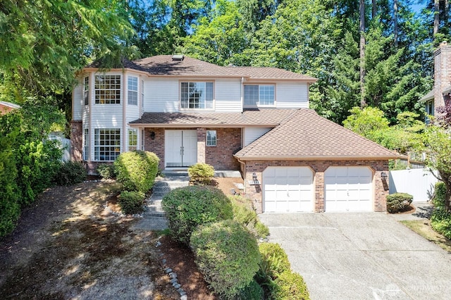 16909 NE 37th Pl, Bellevue, WA 98008 - traditional-style house featuring an attached garage, brick siding, asphalt driveway, and roof with shingles