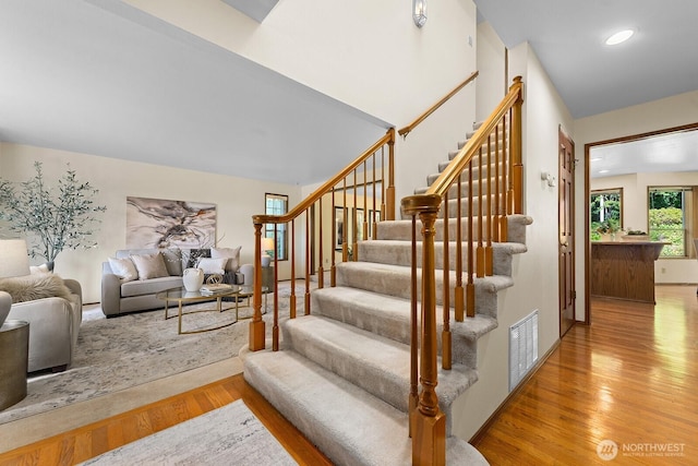 16909 NE 37th Pl, Bellevue, WA 98008 - staircase with wood finished floors and recessed lighting